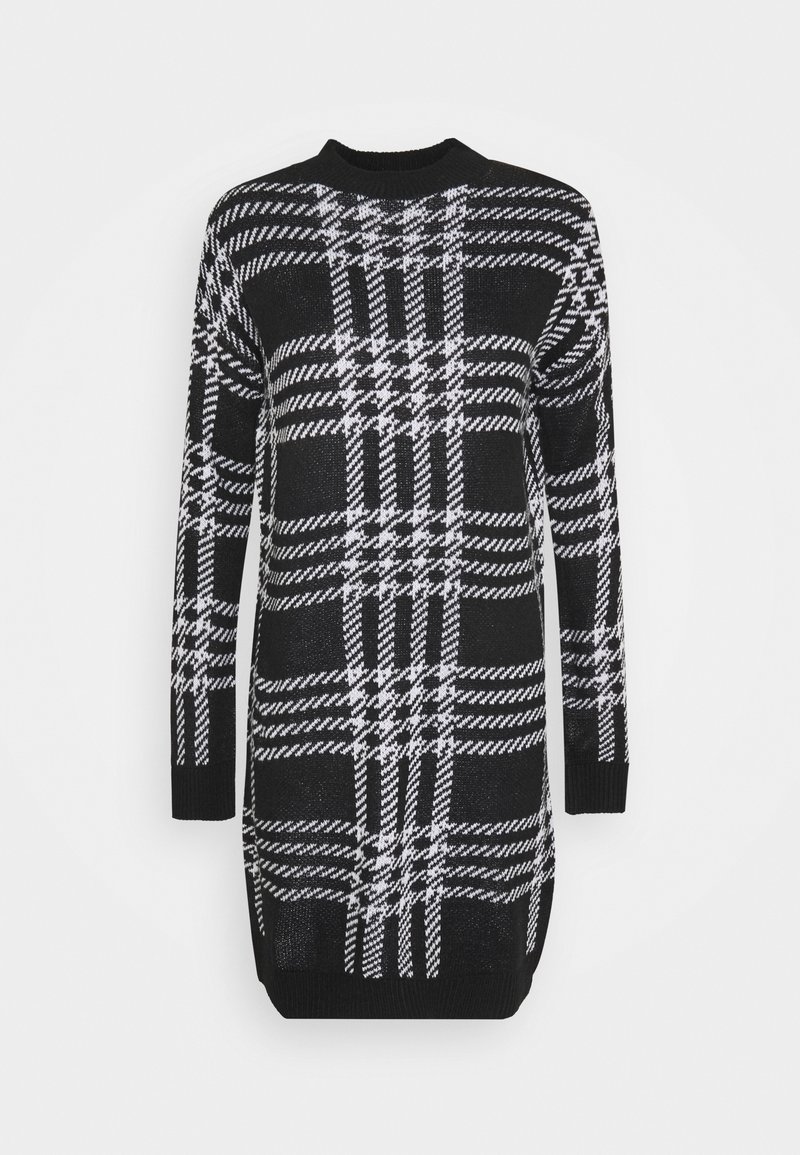 Robe-pull à manches longues en maille noir et blanc avec un grand motif à carreaux et des poignets et un ourlet côtelés.