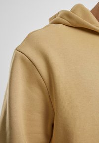 Urban Classics Jaka ar rāvējslēdzēju - unionbeige