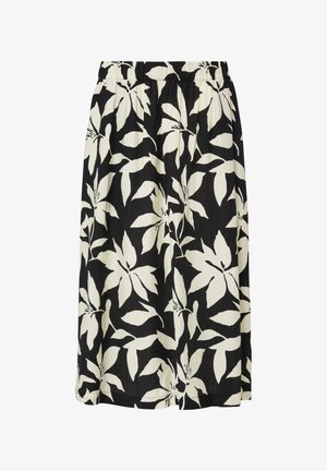 Zwarte midirok met grote witte tropische bladerenprint en elastische tailleband.