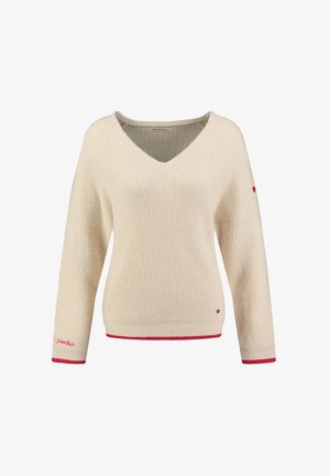 Hellbeiger Rippstrickpullover mit V-Ausschnitt, langen Ärmeln, roten Akzenten am Saum und an den Bündchen sowie einem kleinen Logo-Detail.