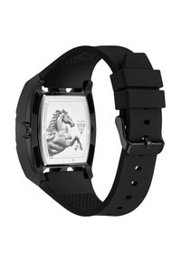 Dos d'une montre noire avec plaque arrière en acier inoxydable gravée d'un cheval cabré et bracelet en silicone noir avec boucle.