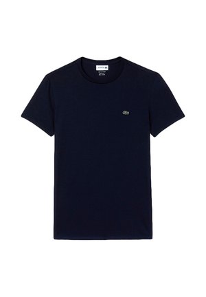 Mornarsko modra bombažna majica s krojenim ovratnikom, kratkimi rokavi in zelenim vezenim logotipom na levem prsnem delu. Gladka tekstura, brez vzorcev.