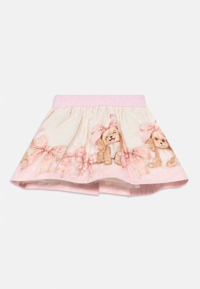 Rosa skjørt med elastisk midjebånd, med hundeillustrasjoner og mønstrede sløyfer langs kanten, laget av lett stoff.
