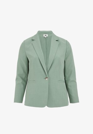 Fényzöld blézer, textúrás anyagból készült. Egyszerű gombos záródással, furchéjsakkal és két elülső zsebbel rendelkezik. Ujja hossza 3/4.