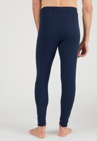 Navy blue leggings made from stretchy fabric, featuring a smooth texture, fitted design, and a full-length cut without visible seams.