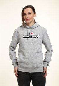 Šedá mikina vyrobená z měkké látky s pixelovanou grafikou "Miluję MINECRAFT". Obsahuje klokaní kapsu a kapuci se šňůrkami.