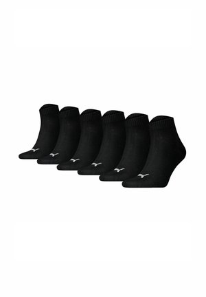 Black ankle socks, six-pack, made from a soft fabric. Features a ribbed cuff and a small white logo on the side.