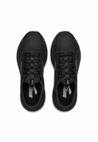 Scarpe da corsa nere con una tomaia in rete testurizzata, dotate di lacci e di un marchio discreto sui lati. La suola ha un colore a contrasto.