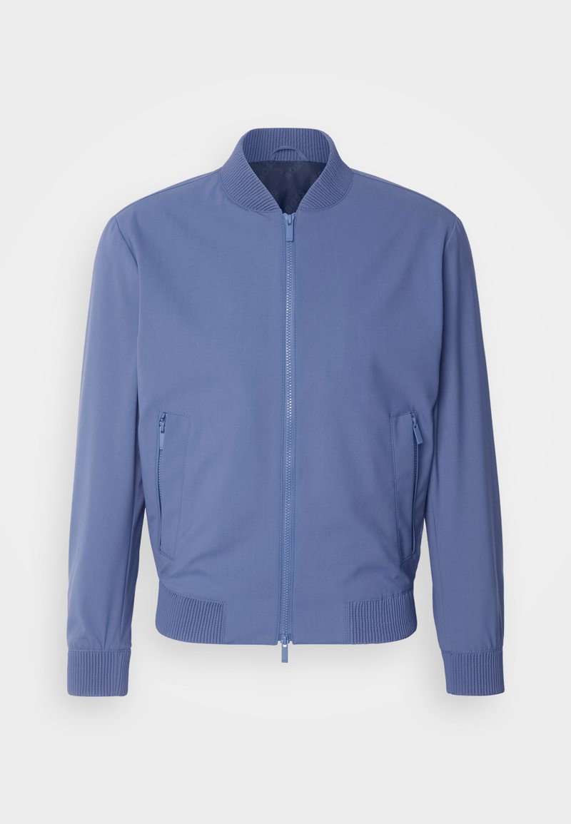 Veste bomber bleu clair en tissu lisse, avec une fermeture éclair à l'avant, un col côtelé, des poignets côtelés et deux poches latérales zippées.
