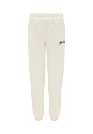 Krémové jogger kalhoty vyrobené z měkké látky s elastickým pasem, zúženými kotníky a námořnickým vyšitým logem po straně.