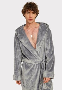 Gray, plush robe with a shawl collar, long sleeves, and a fabric belt, featuring a soft texture and uneven surface pattern.