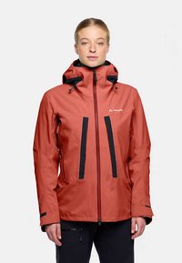 Red waterproof jacket with black accents, front zipper, adjustable hood, and two zippered pockets on the sides. Smooth, durable fabric.