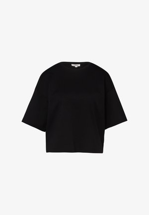 T-shirt noir surdimensionné à manches courtes avec col rond et ourlet droit, présenté sur un fond blanc.