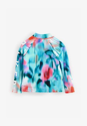 Ilgų rankovių maudymosi marškiniai su daugiaspalviu abstract raštu mėlynos, rožinės ir oranžinės spalvų, su baltu tekstu ant rankovės. Drėgmę išgarinanti medžiaga.