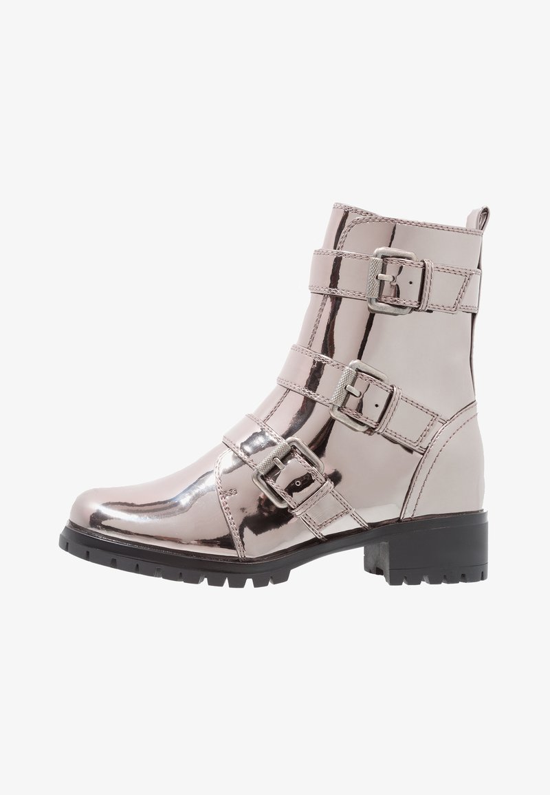 Metallic pink ankle boot with three adjustable buckle straps, rounded toe, and a textured rubber sole for grip. Smooth surface finish.