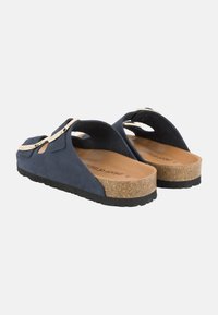 Sandali slide in suede blu navy con soletta in sughero, caratterizzati da punta aperta, cinturini regolabili e suole in gomma per una buona aderenza.
