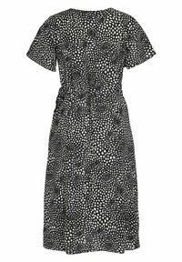Rochie alb-negru cu buline, cu mâneci scurte, talie strânsă și fustă largă. Fabricată dintr-un material ușor, cu o textură moale.