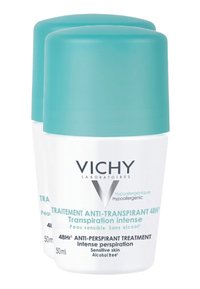 Zwei zylindrische weiße Behälter mit türkisfarbenen Kappen, beschriftet mit "Vichy", für alkoholfreies Antitranspirant, jeweils 50 ml, mit glatter Textur.