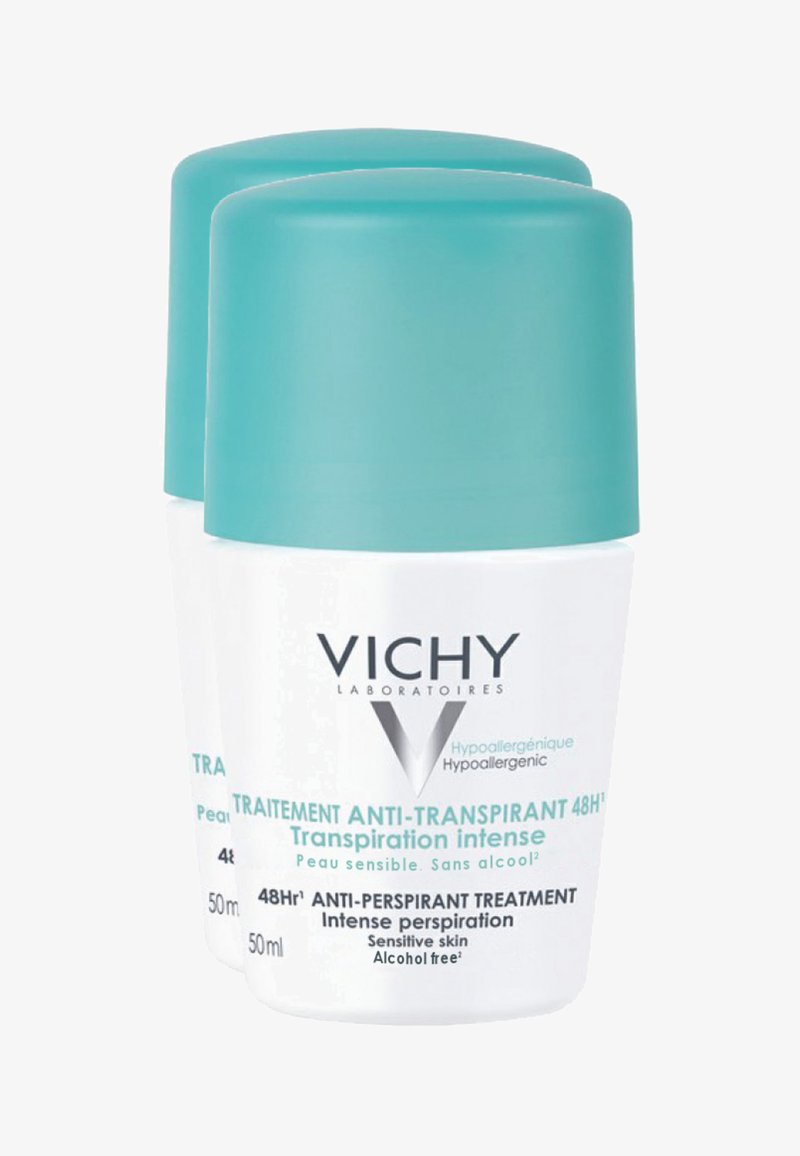 Zwei zylindrische weiße Behälter mit türkisfarbenen Kappen, beschriftet mit "Vichy", für alkoholfreies Antitranspirant, jeweils 50 ml, mit glatter Textur.
