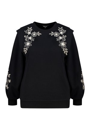 Zwarte sweatshirt met lange mouwen en een ronde halslijn. Voorzien van verfijnde witte bloemenborduursels op de schouders en mouwen.