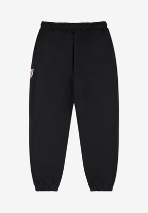 Czarne spodnie dresowe z elastycznym pasem i mankietami. Posiadają małą, kolorową naszywkę z logo na lewej udzie. Wykonane z miękkiego, teksturowanego materiału.