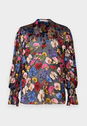 Juoda permatoma bluzelė su ryškia gėlių raštiniais raudona, rožine, mėlyna ir geltona spalvomis. Turi susirinkusias rankoves ir subtilią apykaklės detalę.