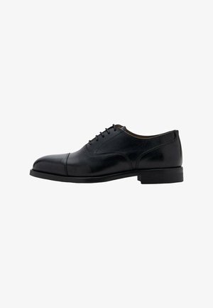 Black leather dress shoe with a smooth finish, rounded toe, and five eyelets for laces. Features a low, rectangular heel and sleek design.