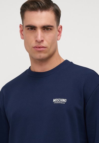 Mornarskoplavi dukserica od mješavine pamuka, sa okruglim izrezom i bijelim vezom "MOSCHINO UNDERWEAR" logotipa na prsima.