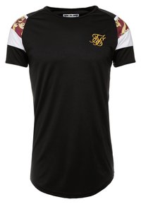 Musta urheilupaita lyhyillä hihoilla; siinä on valkoiset ja burgundinpunaiset kuviot hartioissa sekä kultainen logo rinnassa. Sileä pinta.