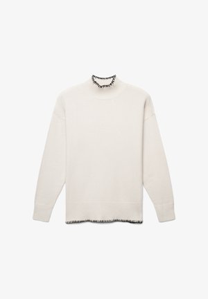 Cream-colored sweater with a high neck and black ruffled trim. Features dropped shoulders and a straight, relaxed fit. Soft texture.