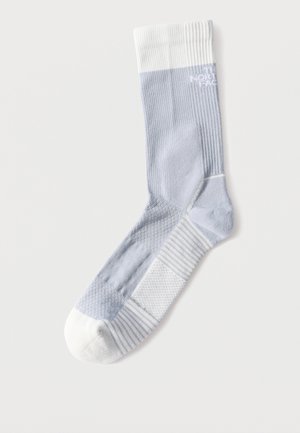 Light gray and white athletic sock with ribbed texture and cushioning, branded with "The North Face" near the top.