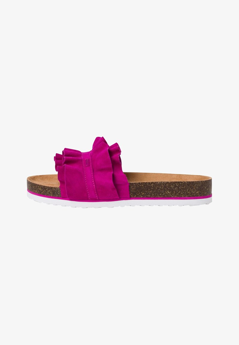 Fuchsia slide sandal with a textured fabric upper featuring ruffled accents, a cork footbed, and a white rubber sole.