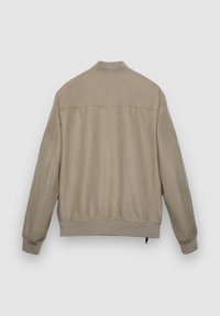 Veste bomber beige en tissu lisse. Dotée d'un col arrondi, de poignets et d'un ourlet côtelés. Design uni sans motifs ni ornements visibles.