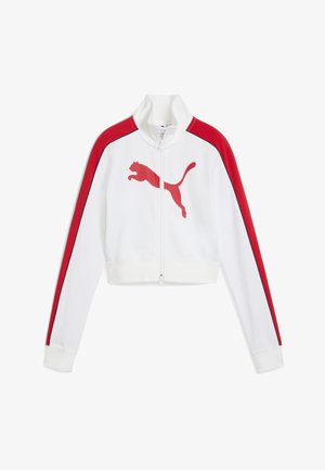 Valge lukuga jakk punaste detailide ja musta ääristusega. Ees on suur punane Puma logo. Lühendatud disain pikkade varrukatega.