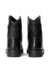Black leather ankle boots with a rounded toe and smooth texture. Back has distinctive high cut and additional leather straps for detail.