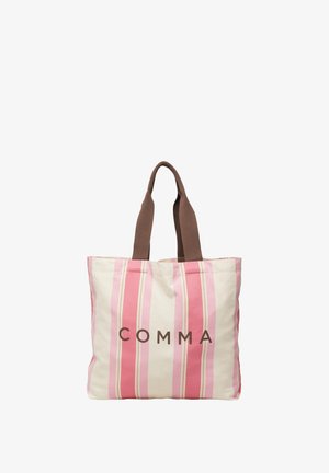 Torba na ramię w różowo-białe paski z brązowymi uchwytami i napisem „COMMA” wydrukowanym dużymi brązowymi literami z przodu.