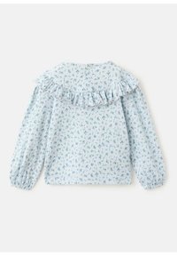 Light blue blouse with a ruffled neckline, elasticated long sleeves, and small green floral print on textured fabric. Features a back button closure.