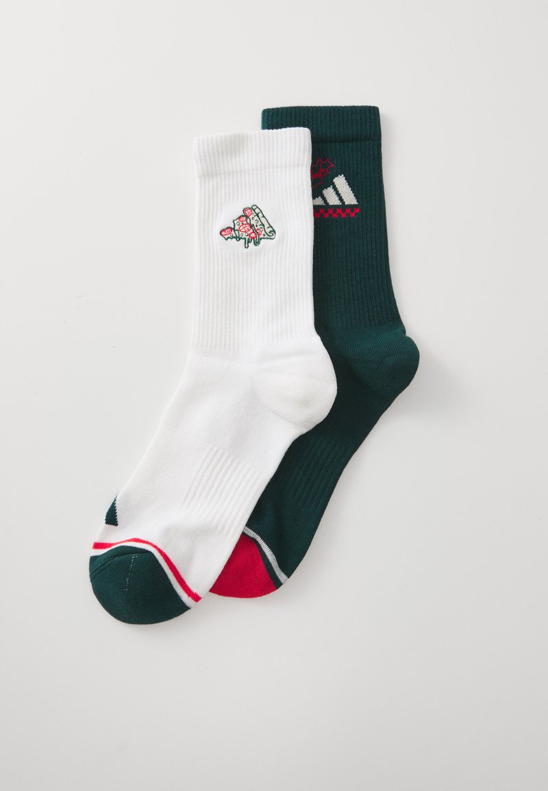White and dark green crew socks, featuring a floral design on the white pair and striped accents on the green, with ribbed texture.