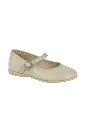 Zapato plano tipo Mary Jane en beige con una única correa ajustable con hebilla y punta redondeada.