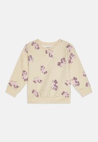 Sweatshirt à manches longues jaune en tissu doux, avec un motif de licorne ludique en rose et violet. Poignets et ourlet côtelés.