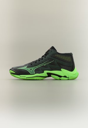 Schwarzer und neongrüner halbhoher Sportschuh mit strukturierter Sohle und dem Schriftzug "Wave Lightning Elite" an der Seite.