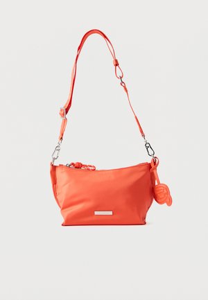 Small orange shoulder bag with adjustable strap, zipper closure, and a decorative charm attached to the side.