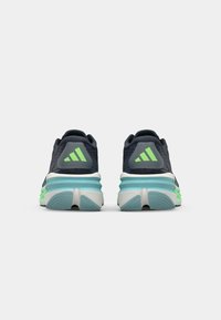 Navy athletic shoes with neon green accents, textured mesh upper, cushioned midsole, and rubber outsole. Features three stripes logo.
