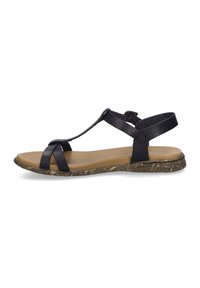 Sandalo in pelle nera con design a T, suola marrone testurizzata e decorata, e soletta imbottita beige. Cinturino alla caviglia regolabile per una migliore vestibilità.