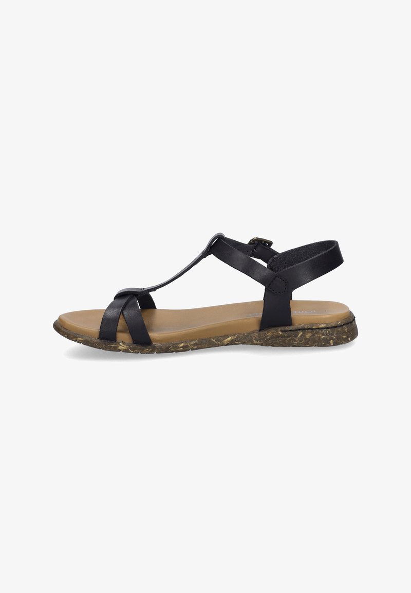 Black leather sandal with T-strap design, cushioned tan footbed, and textured, patterned brown sole. Adjustable ankle strap for fit.