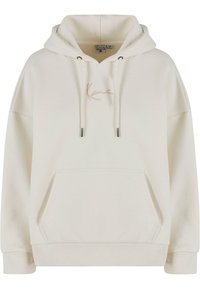 Cream hoodie with a drawstring and a front pocket. Features embroidered logo in beige. Made from soft, textured fabric.
