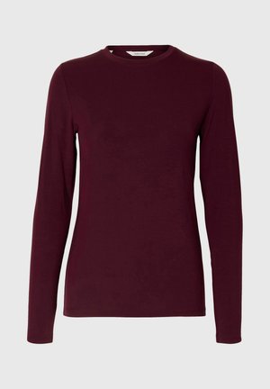 Maglietta a maniche lunghe bordeaux in tessuto morbido, con scollo rotondo e silhouette aderente. Nessun motivo visibile o dettagli in hardware.