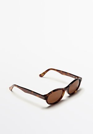 Runde Sonnenbrillen mit braun getönten Gläsern und dunklem Schildpatt-Acetatrahmen. Elegantes Design, glatte Textur und gebogene Bügel.