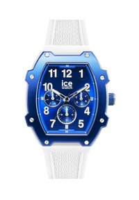Reloj analógico azul con una correa de silicona blanca texturada, caja octogonal y tres subesferas. Presenta marcadores de hora en negrita y una corona.