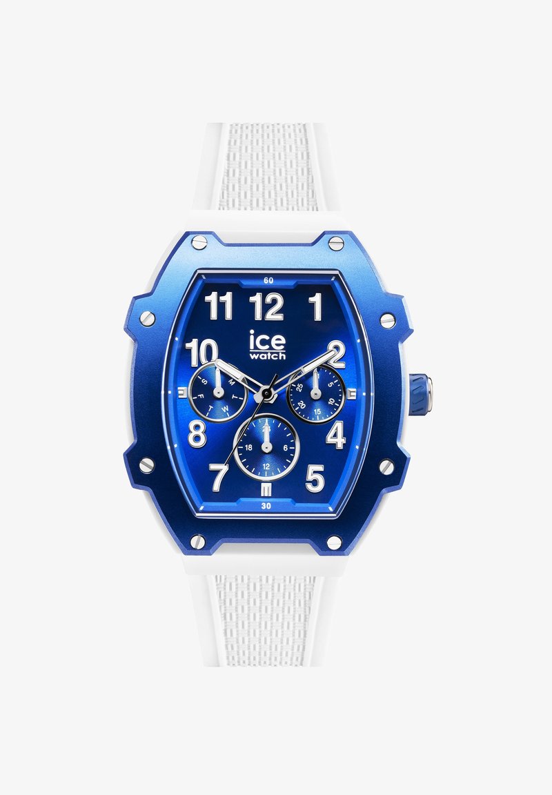 Blauw analoge horloge met een gestructureerde witte siliconen band, octagonale kast en drie sub-dials. Heeft opvallende uurmarkeringen en een kroon.